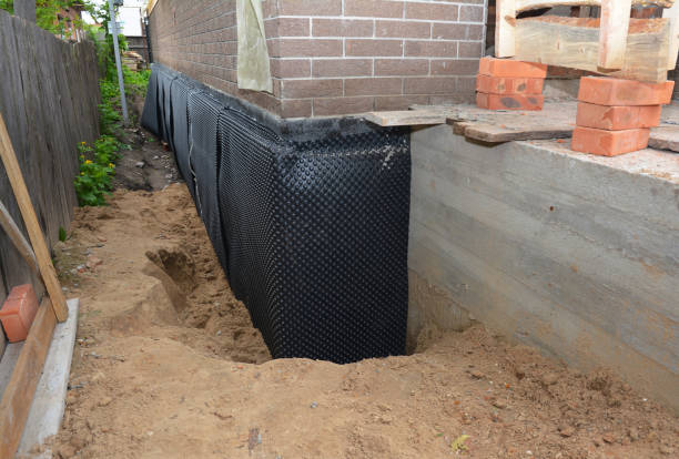 Happy homeowners after waterproofing job in Peninsula